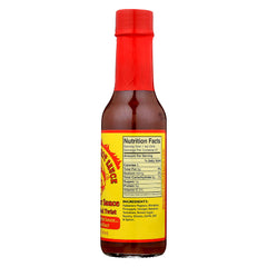 Dirty Dick's hot sauce bottle pour showing smooth flow for dipping.