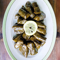 Divina Dolmas served with feta and pita, a classic Mediterranean starter