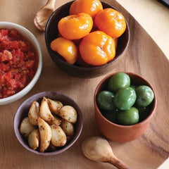 Divina Organic Castelvetrano olives on an antipasti plate with cheese and bread.