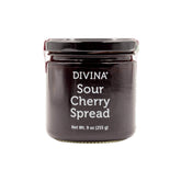 Divina sour cherry spread jam jar shows rich ruby color, perfect for cheese pairing.