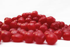 DM Sweets Cherry Sours candy closeup showing tangy flavor and glossy surface