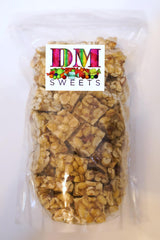 DM Sweets peanut squares close-up highlighting crunchy texture and glaze