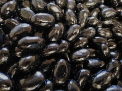 DM Sweets jumbo licorice beans in bulk bag, cost-effective party snack.