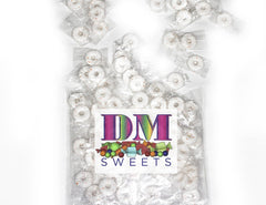 DM Sweets Orange Mints hard sucking candy closeup showcasing crisp texture for refreshment.