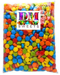 DM Sweets rainbow pucker candy closeup crunch highlights sour fruity flavors.