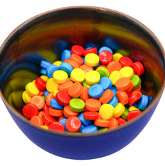 DM Sweets rainbow pucker candy in vending machine setup demonstrates quick snack.