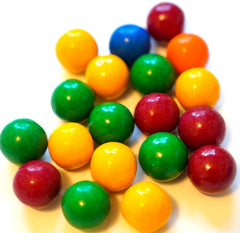 DM Sweets orange flavor gumballs with tangy powder inside—burst of citrus