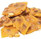 DM Sweets peanut brittle smooth-creamy-bite highlighting rich texture and flavor