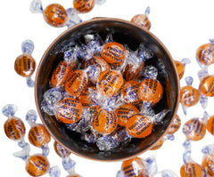DM Sweets butterscotch buttons unwrapped revealing individually wrapped bulk candy