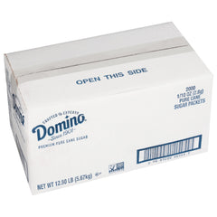 Domino sugar packets in a dispenser box for quick, measured sweetening.