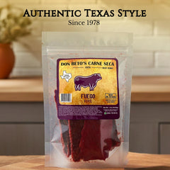 Don Beto's Carne Seca Fuego beef jerky closeup shows bold red spice and texture.