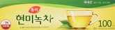 Dongsuh Brown Rice Green Tea bag in cup with smooth aroma for daily ritual.