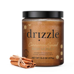 DRIZZLE Cinnamon Spiced Raw Honey bottle ready for tea and toast