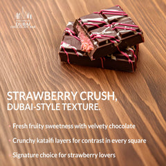 Sliced Dubai Choco Strawberry Crush reveals strawberry cream and chocolate layers.