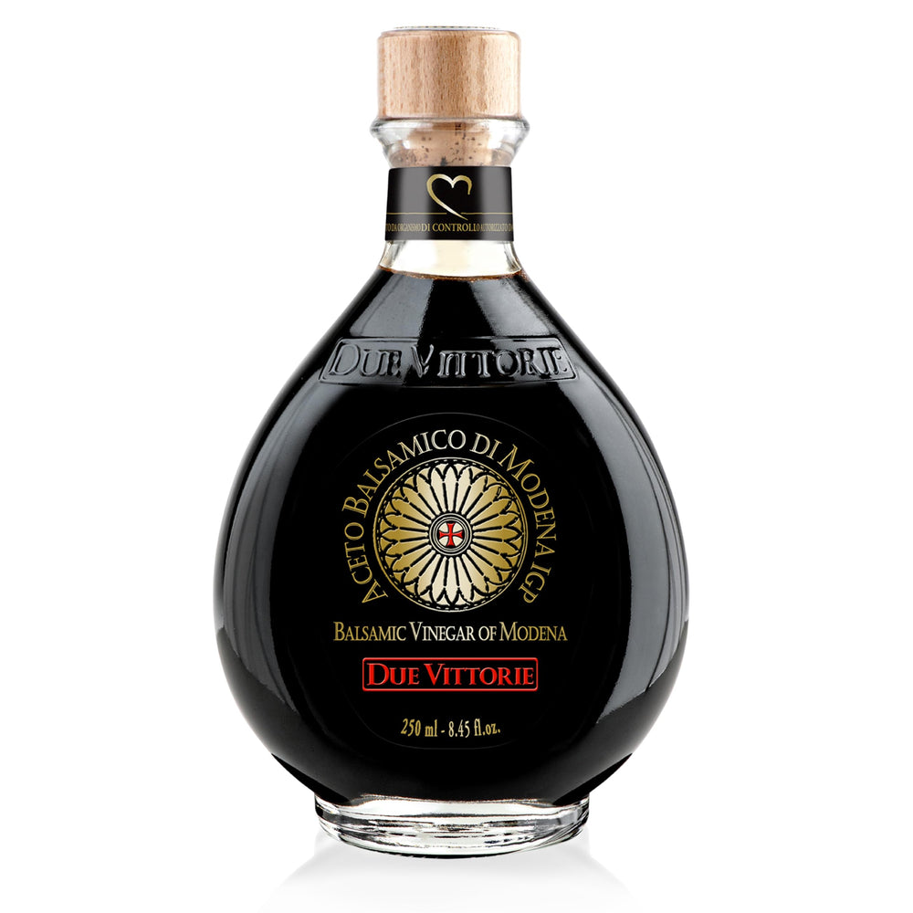 Due Vittorie Oro Gold bottle with cork pourer for controlled drizzle over dishes.