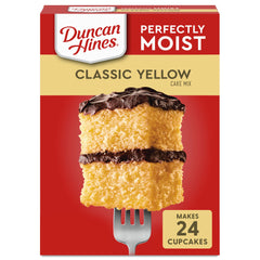 Duncan Hines Classic Yellow Cake Mix box on a sunny kitchen counter, ideal for Easter desserts.