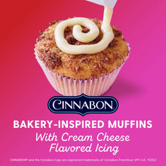 Duncan Hines Epic Cinnabon muffin batter being poured into tins for fluffy results.