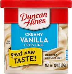 Duncan Hines Frosting on brownies creates a sweet vanilla drizzle.