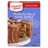Duncan Hines Signature Fudge Marble Cake Mix box on a kitchen counter for quick baking