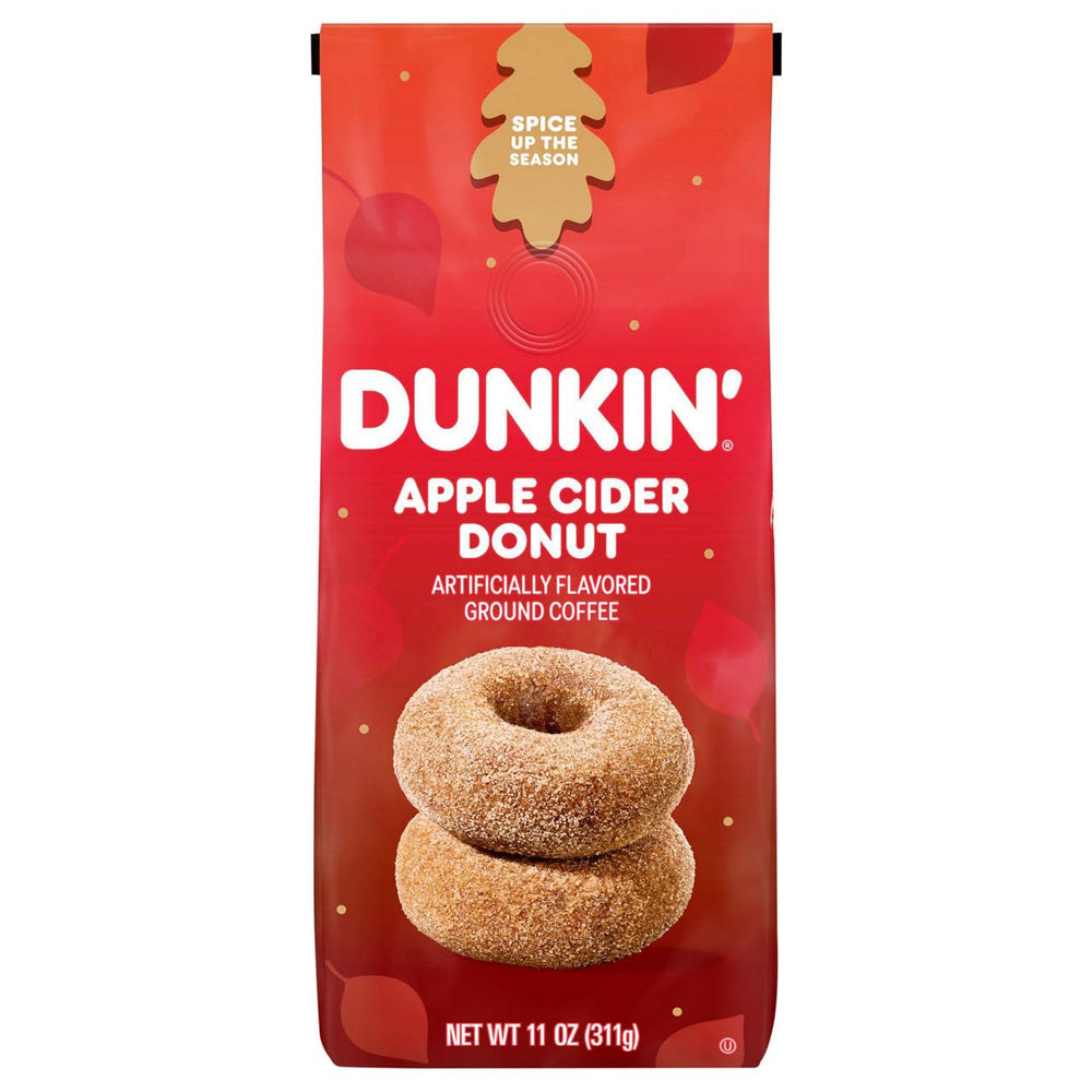 Dunkin Apple Cider Donut Ground Coffee 11 Ounce bag on a kitchen counter, ideal for cozy autumn mornings.
