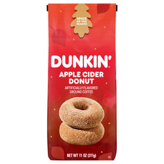 Dunkin Apple Cider Donut Ground Coffee 11 Ounce bag on a kitchen counter, ideal for cozy autumn mornings.