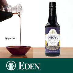 Close-up of Eden Shoyu glass bottle, rich color and purity for cooking.