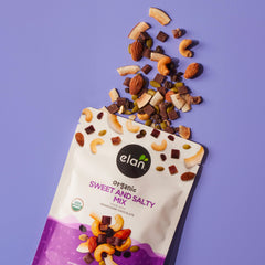 Elan Sweet & Salty Mix sprinkled over yogurt for a nutritious breakfast topping.