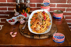 El Manar solid tuna in olive oil can back label showing quality and sustainability.