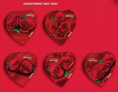 Inside view shows assorted chocolates arranged in a heart shape for sharing.