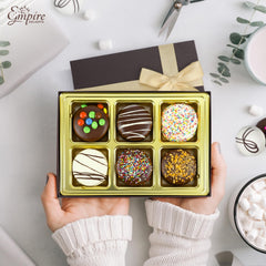 Empire Delights creme-filled sandwich cookies with toppings, offering a playful texture contrast