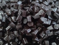 Emporium Candy licorice bites in hand, ready to enjoy