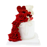 Ercadio red rose cake topper assembly adds elegant Valentine's dessert flair.