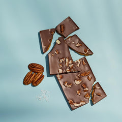 Close-up of Ethel M sea-salt caramel bar showing silky caramel center.