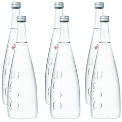Eviian natural mineral water in a glass bottle elevates table setting and refreshment