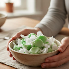 Party favor setup featuring Fairtime Green Apple Taffy ready for guests.