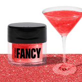 Fancy Sprinkles Ruby Red edible glitter jar adds prismatic sparkle to desserts.