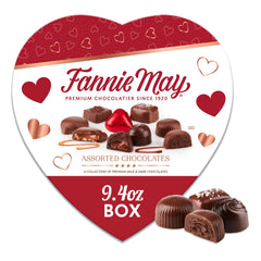 Fannie May heart gift box top view showing an elegant chocolate assortment for gifting.