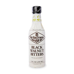 Fee Brothers Black Walnut bitters bottle being poured for cocktails.