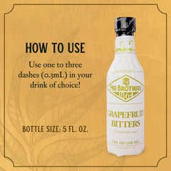 Fee Brothers Grapefruit Bitters bottle beside a cocktail glass shows versatile flavor accents.