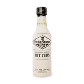Fee Brothers Old Fashioned Bitters bottle being poured to elevate cocktails