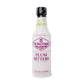 Fee Brothers Plum Bitters bottle on display adds aromatic depth to cocktails.