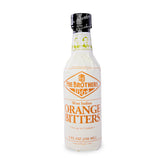 Fee Brothers West Indian Orange Bitters bottle on bar, citrus depth for cocktails