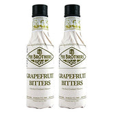Fee Brothers Grapefruit Cocktail Bitters bottle on a bar shelf to brighten citrus cocktails.