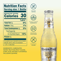 Fever-Tree Light Tonic Water poured into a glass for a refined cocktail.