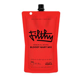 Filthy Food Bloody Mary Mix pouch on a bar counter, ready for restaurant-quality cocktails at home.