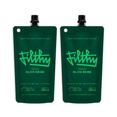Filthy Food olive brine bottle pour showing bar-quality martini base