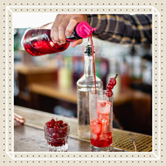 Finest Call cocktail mix color highlights vibrant consistency for drinks.