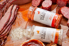 Fiorella's Jack Stack Dry Rub on chicken during grilling for savory bite.