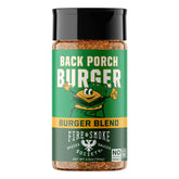 Fire & Smoke Society Back Porch Burger bottle on grill enhancing beef flavor.