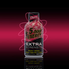 Pouring a 5-hour ENERGY Extra Strength Cherry flavor shot for fast alertness during busy work hours